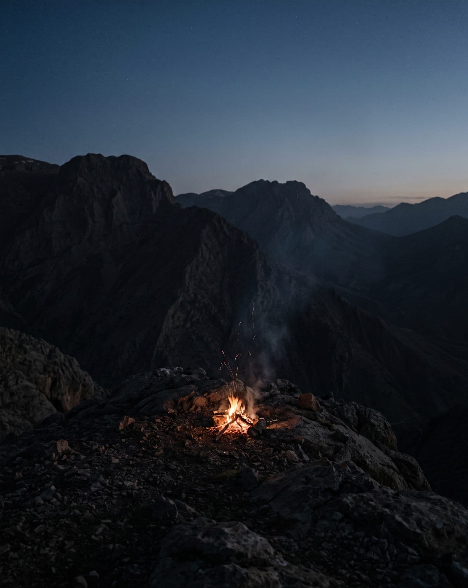 A small fire on a dark mountain ridge on the night of Newroz